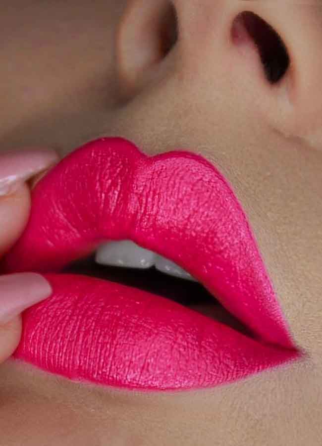 Audacious (bright pink shade) lipstick swatch