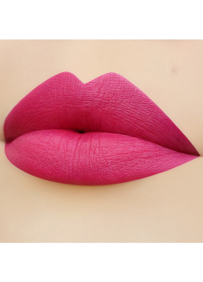 Audacious (bright pink shade) lipstick swatch on paler skin