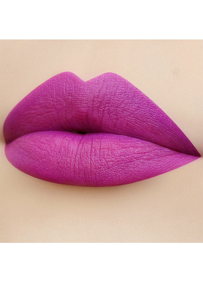 Hazardous (vibrant purple shade) lipstick swatch on paler skin