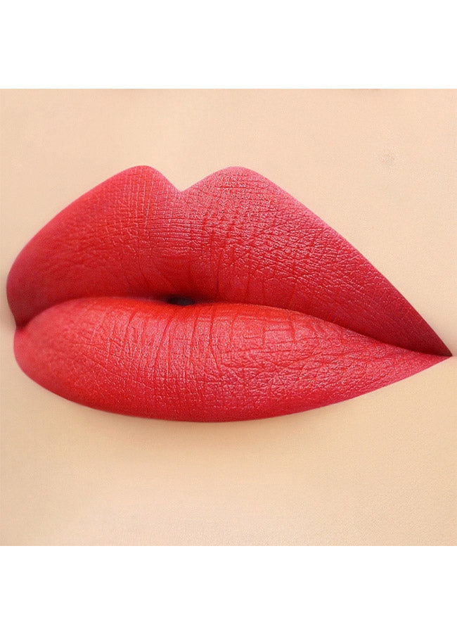 Socialite (bright coral red shade) lipstick swatch on paler skin