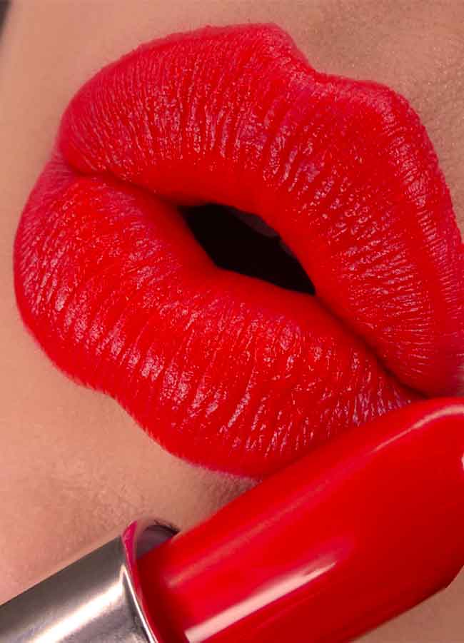 Socialite (bright coral red shade) lipstick swatch