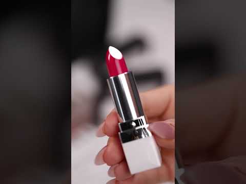 Video showing Audacious (bright pink) Lipstick + hand swatch of colour