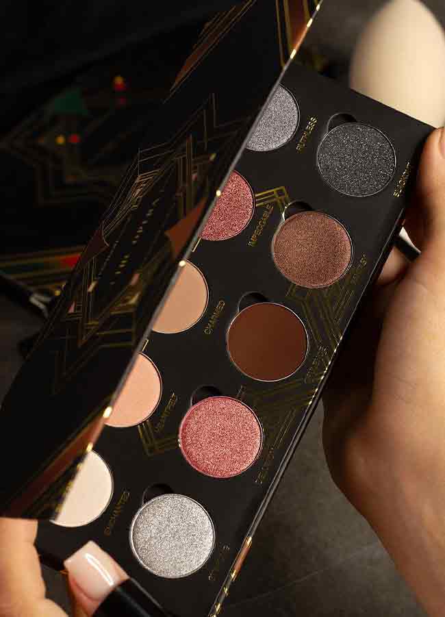 The Opera Eyeshadow Palette half open showing shades.